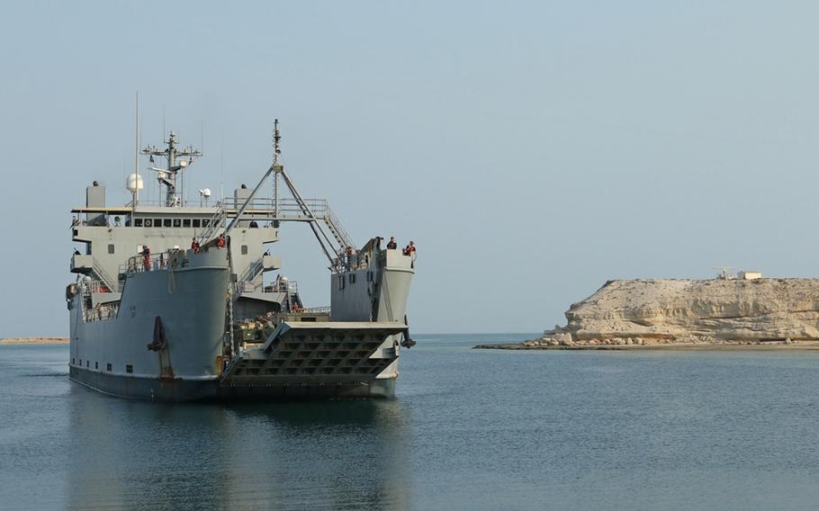 U.S. Army Logistics Support Vessel-5, Maj. Gen. Charles P. Gross arrives at a port in the Persian Gulf for the 3rd Armored Brigade Combat Team, 1st Cavalry Division to unload their equipment for an exercise in the United Arab Emirates in 2017. The Army has suspended plans to shut down its watercraft units and auction off ships while a congressional review is ongoing.