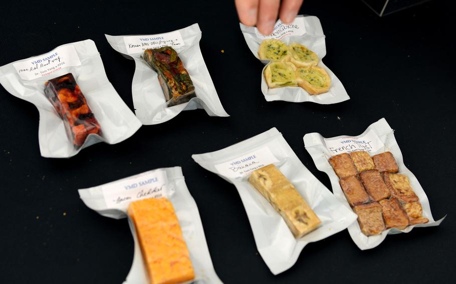 The prototype Close Combat Assault Ration on display at the Pentagon May 24, 2018 includes a tart cherry nut bar, cheddar cheese bar, mocha desert bar, vacuum-dried strawberries and trail mix of fruit and nuts, among other items that were vacuum microwave-dried.