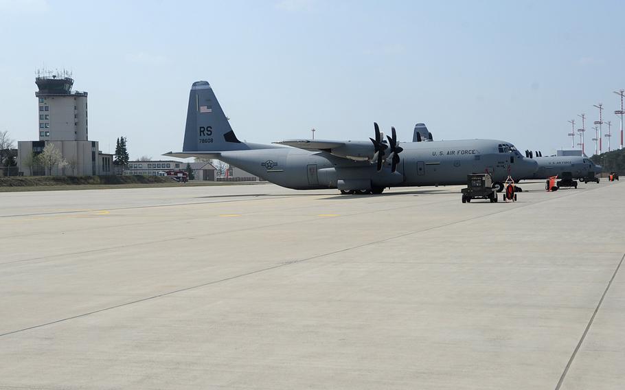 A pair of C-130 Hercules cargo planes sit on the tarmac at Ramstein Air Base, Germany. Nearly one-fourth of the Air Force's fleet of C-130s is being pulled for inspection after ''atypical'' cracks were found on the lower center wing joint during scheduled depot maintenance, Air Mobility Command announced late Wednesday, Aug. 7, 2019.