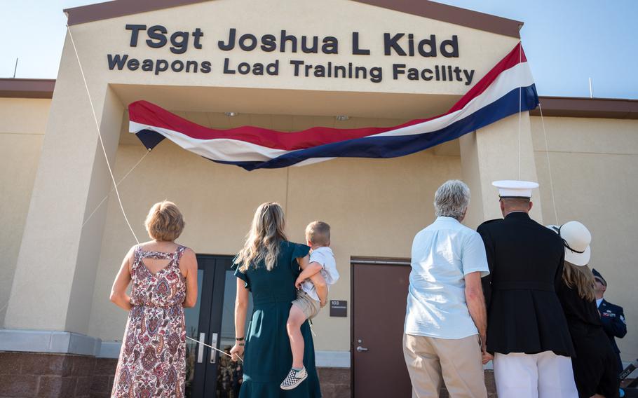 The Kidd family unveil the new name of the Kidd Weapons Load Training facility at Barksdale Air Force Base, La., in honor of the late Tech. Sgt. Joshua L. Kidd, Aug. 16, 2019. Kidd was killed last fall in an attempted break-in of his vehicle outside his home in Bossier, La.