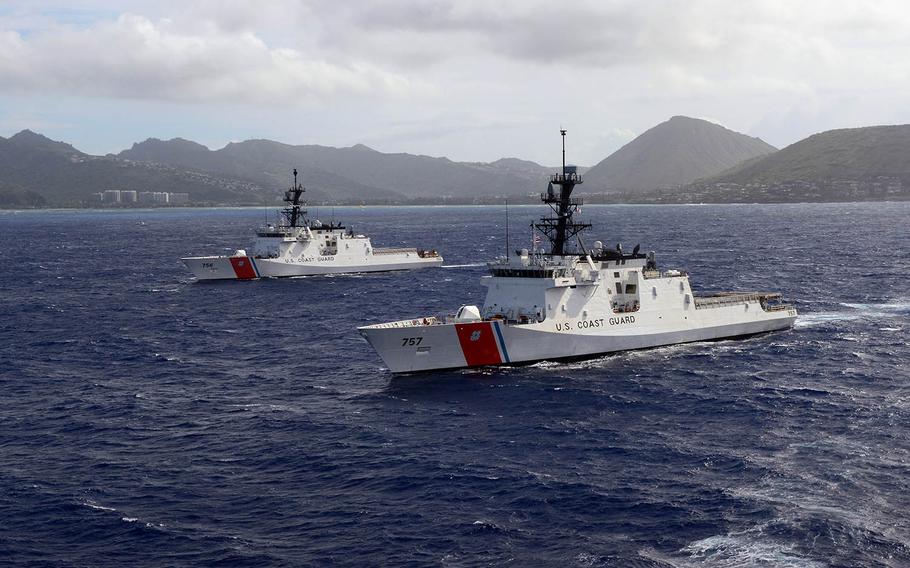 The Coast Guard cutters Midgett and Kimball sail past Koko Head on Oahu, Hawaii, Aug. 16, 2019.
