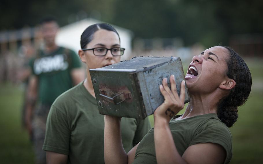 An officer candidate lifts an ammo can during a combat fitness test at Marine Corps Base Quantico, Va., July 16, 2019.