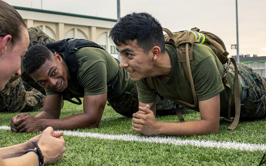 Marines perform planks during physical training at Marine Corps Air Station Iwakuni, Japan, July 26, 2019.