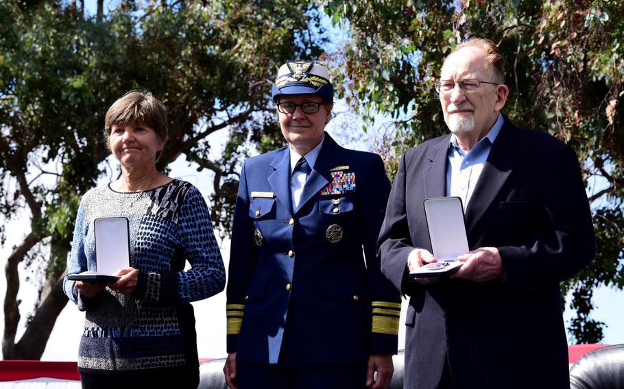 Coast Guard Vice Adm. Linda Fagan, Pacific area commander (center) stands with Lisa Rehman and Bob Kelleher, who accepted Purple Heart medals on behalf of family members killed in World War I, during a ceremony on Coast Guard Island in Alameda, Calif., Sept. 3, 2019.