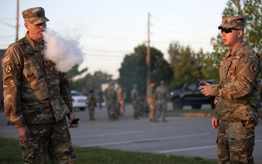 Sgt. 1st Class Bryson Briles, left, and Staff Sgt. Jorge Flechas enjoy a relaxing moment vaping before heading to class at U.S. Army Recruiting and Retention College Sept. 5, 2019. Briles said he vapes as a safer alternative to cigarettes. Flechas said he vapes for recreational purposes. Health officials say they suspect the more than 200 recent deaths and serious illnesses across a 25-state area in the United States are the result of vaping.