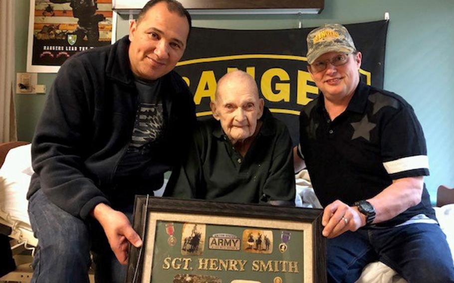 On his 98th birthday, Silver Star recipient Henry C. Smith poses with former Army Rangers Jose Mortenson, left, and Wes Goldman in Traverse City, Mich., May 20, 2019. Smith died on Aug. 5.
