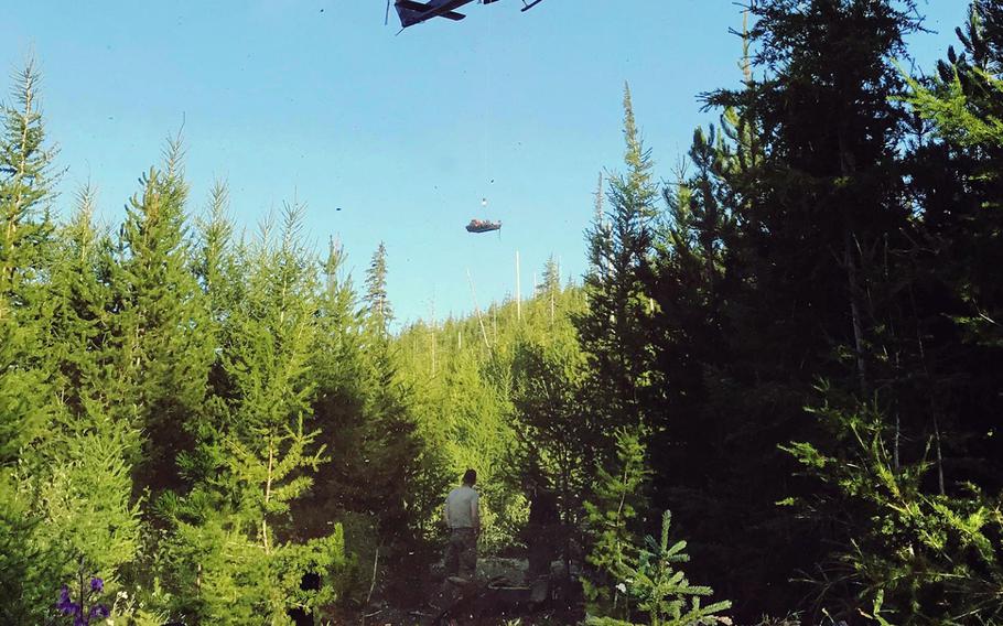 Airmen in a UH-1N Huey conduct the 36th Rescue Squadron's 700th rescue in northeastern Washington, Aug. 12, 2019. The squadron is based at Fairchild Air Force Base, Wash.