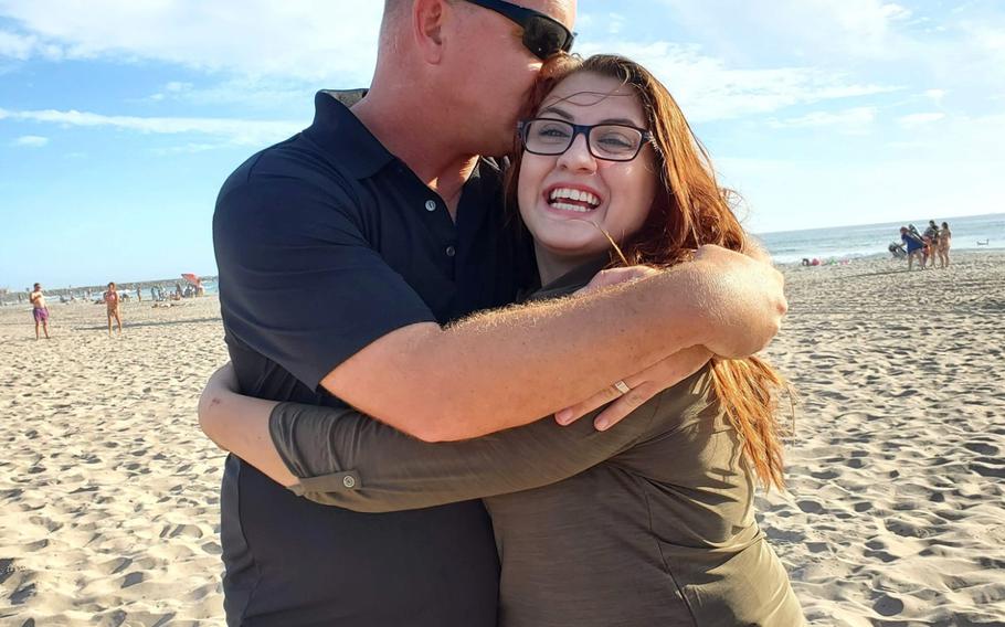 Master Sgt. Jeff Briar and Jennifer Crowley embrace on a California beach. Briar drowned swimming at Del Mar Beach in San Diego when a strong tide swept him out to sea on Sept. 22, 2019.