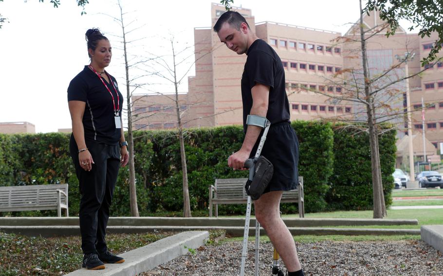 Candace Pellock, physical therapy assistant, guides with Spc. Ezra Maes at the Center for the Intrepid, Brooke Army Medical Center's cutting-edge rehabilitation center on Joint Base San Antonio-Fort Sam Houston, Oct. 2, 2019.