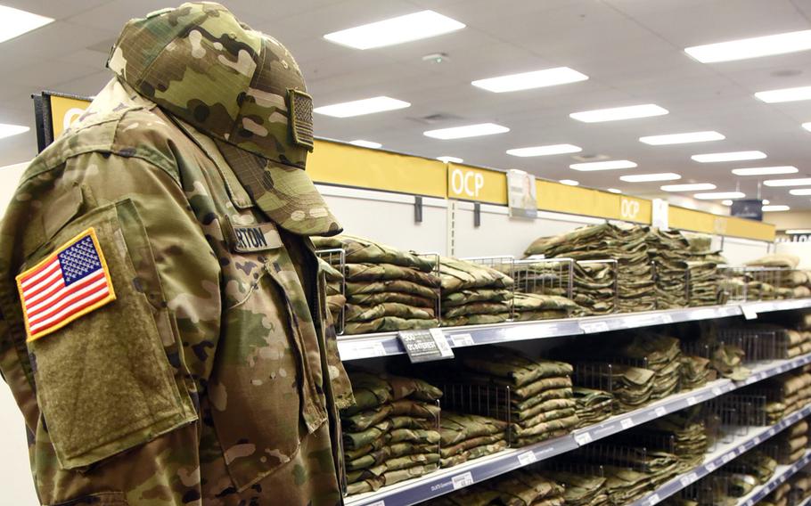 Operational Camouflage Pattern uniforms are offered for sale inside a military clothing store at Tinker Air Force Base, Okla., in August 2019.