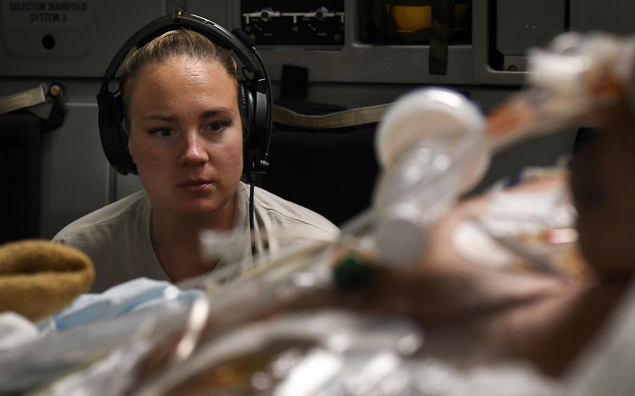 Capt. Natasha Cardinal, a critical care nurse for the 86th Aeromedical Evacuation Squadron at Ramstein Air Base, Germany, monitors a patient during a nonstop flight from Bagram Airfield, Afghanistan, to San Antonio, Texas, Aug. 18, 2019.