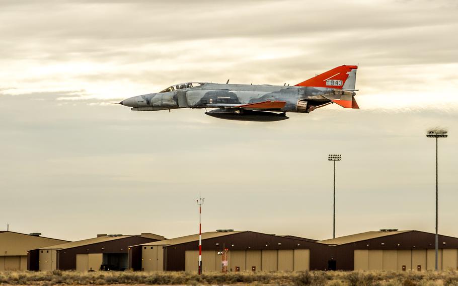 A McDonnell Douglas QF-4 Phantom II of the 82nd Aerial Target Squadron Detachment 1 flies over the flight line during the final flight ceremony for the storied aircraft at Holloman AFB, N.M., Dec. 21, 2016.