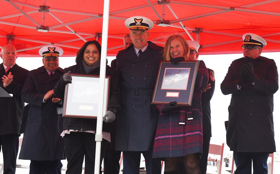 Lisa Palazzo, left, and Angela Danz-Donahue pose with Coast Guard commandant Adm. Karl Schultz after two cutters were named after their late husbands in New York, N.Y., Tuesday, Nov. 12, 2019. Jeffrey Palazzo and Vincent Danz were Coast Guard Reservists who died responding to the Sept. 11, 2001, attacks on the World Trade Center.