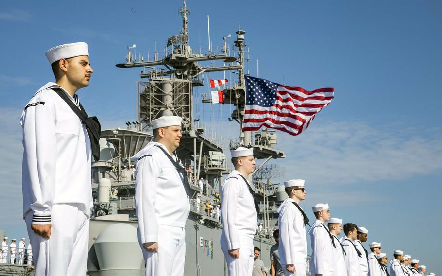 Sailors man the rails aboard the amphibious assault ship USS Kearsarge as it pulls into its home port at Norfolk, Va.  A shakeup in sea/shore tour lengths will see 20 ratings with longer sea tours, 22 ratings with shorter sea tours and seven ratings with longer shore tours.