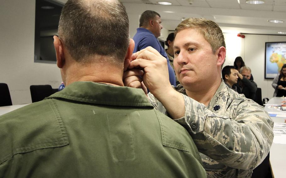 Lt. Col. James Cox, an Air Force doctor, practices acupuncture as a form of pain management for traumatic brain injury at Landstuhl Regional Medical Center, Ramstein Air Base, Germany, Sept. 6, 2019.