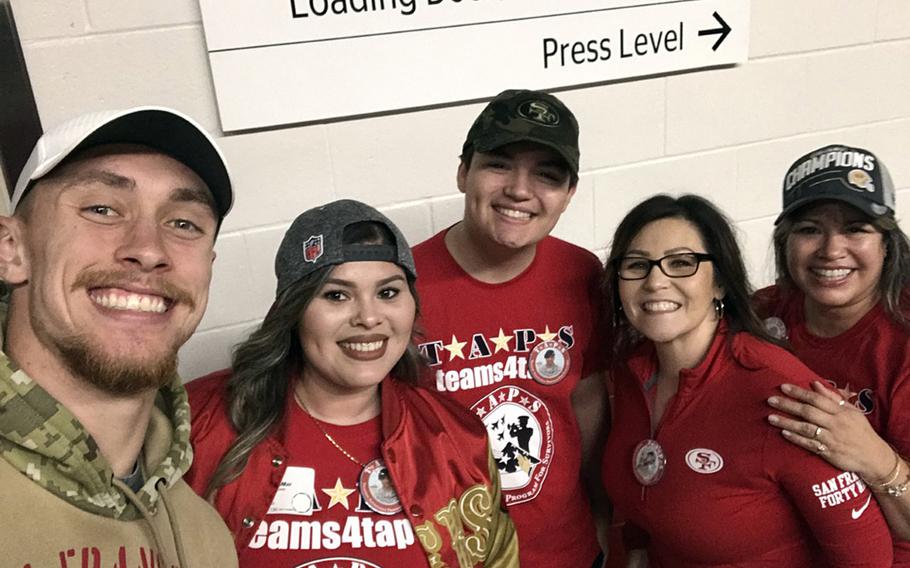George Kittle, left, a tight end for the San Francisco 49ers, meets Jan. 24, 2020, with the family of Mick LaMar, a soldier who was killed in Iraq in 2011. Kittle met with, from left, Alexis, Nicolas and their mother, Josie LaMar, as well as a family friend, as part of a program that gave service members and families a trip to the big game.