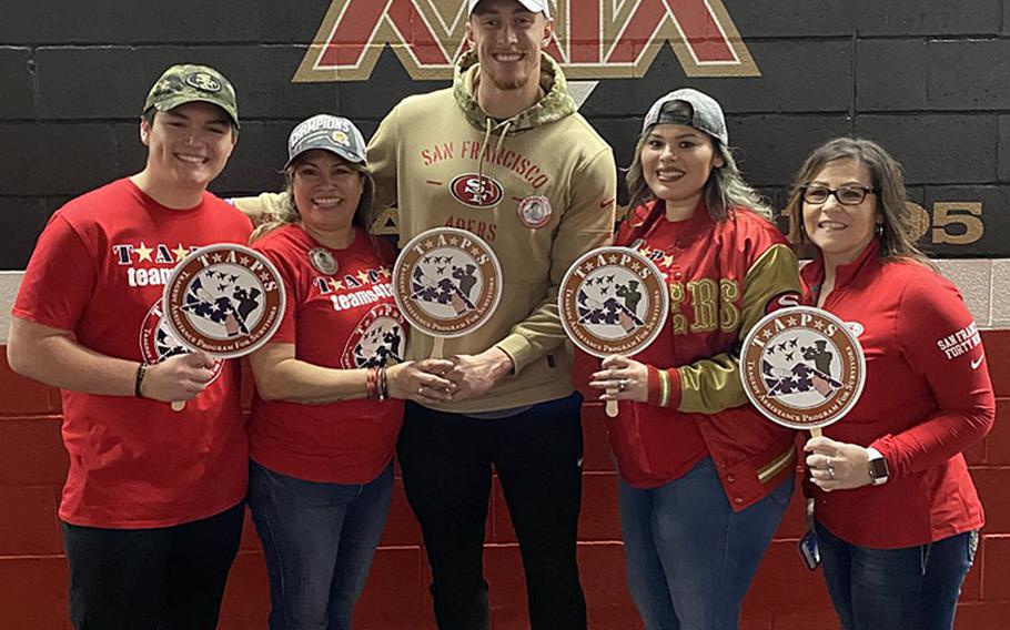 George Kittle, tight end for the San Francisco 49ers, meets  Jan. 24, 2020, with the family of Mick LaMar, a soldier who was killed in Iraq in 2011. Kittle, center, met Nicolas, Josie, and Alexis LaMar, as well as a family friend, as part of a program that gave service members and families a trip to the big game.