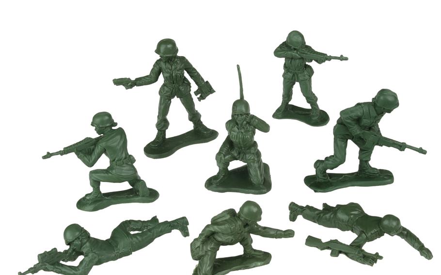 A squad of resin prototype, 2-inch olive drab plastic women soldiers, part of a product line expected to be out later this year.

