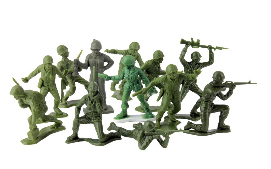 Pictured in the center of a variety of little green plastic Army men is an early sculpt of the female ''Pathfinder captain'' figure, brighter green, developed by to be released with a line of roughly 1:32-scale female soldiers.