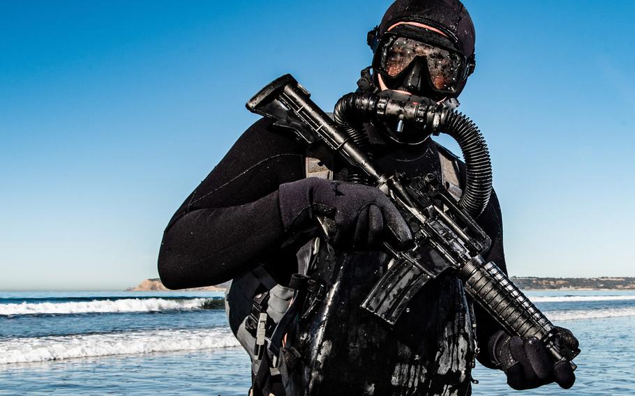 A Naval Special Warfare member conducts dive training at an undisclosed location in the United States on Nov. 2, 2019. A SEAL training at Naval Base Kitsap-Bangor, where the service has long trained in underwater insertion using submersibles, tested positive for the coronavirus Thursday.