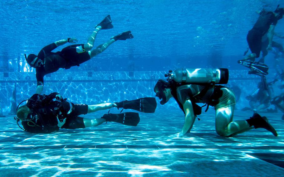 Sailors in SEAL underwater training in Coronado, Calif., on Nov. 5, 2019. A SEAL training at Naval Base Kitsap-Bangor, where the service has long conducted underwater insertion drills using submersibles, tested positive for the coronavirus Thursday.