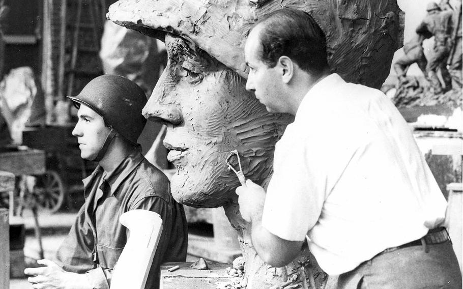 In this undated photo, Marine veteran Rene Gagnon poses for sculptor Felix de Weldon for the Marine Corps War Memorial, which was unveiled Nov. 10, 1954, by President Dwight Eisenhower.