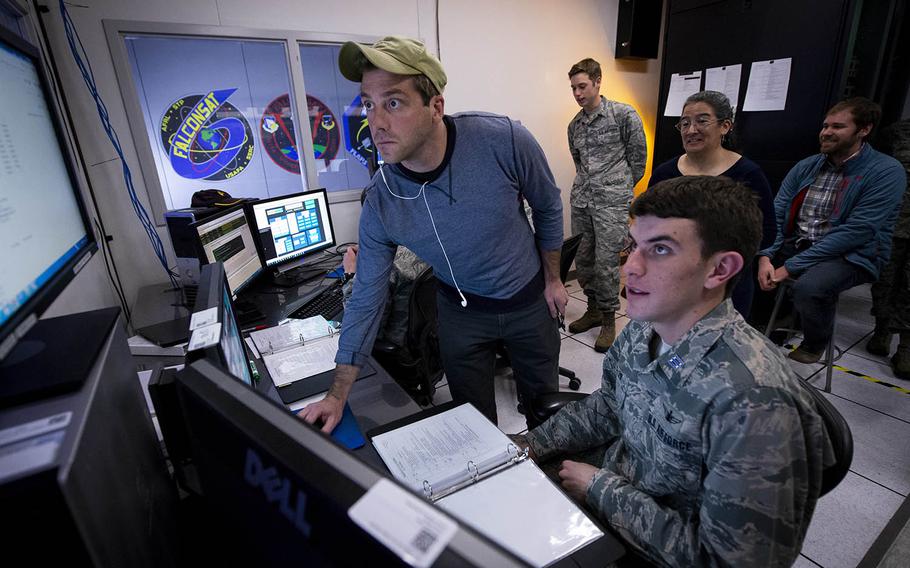 Air Force Academy cadets and faculty members wait to receive their first contact from the cadet-designed FalconSAT-6 satellite, Dec. 3, 2018.