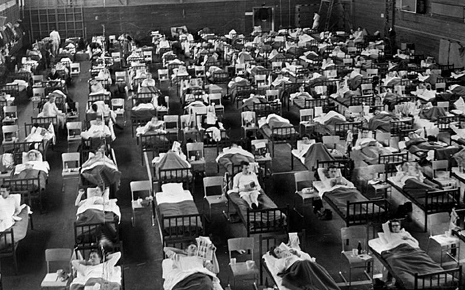 Asian Flu patients are cared for inside a sports arena in Sweden in 1957.