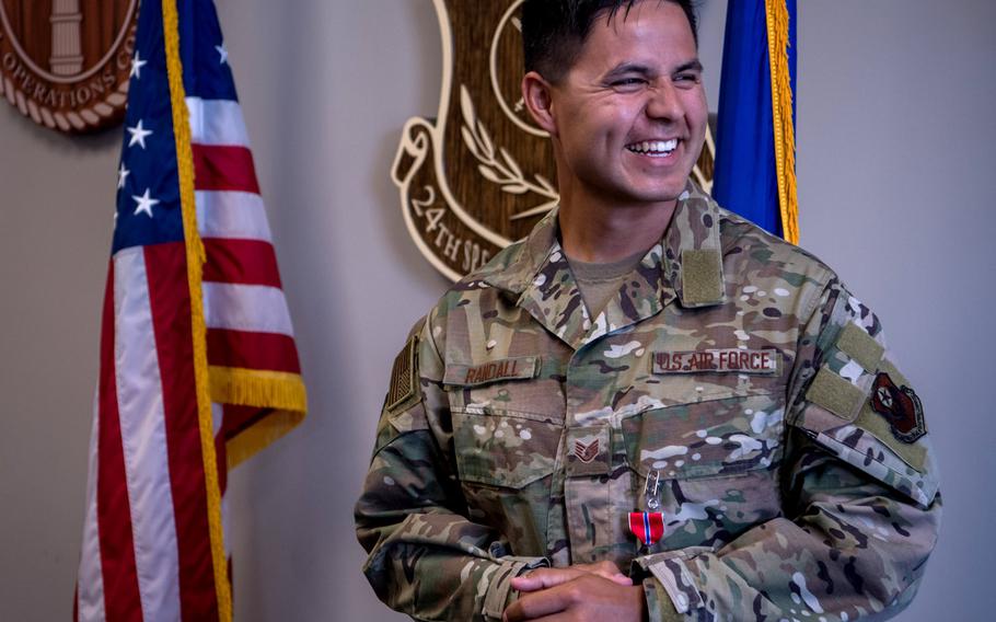 Staff Sgt. Johnathan Randall, Special Operations Surgical Team member assigned to the 720th Operational Support Squadron, smiles during a ceremony at Hurlburt Field, Florida, May 20, 2020, where he received the Bronze Star Medal for his actions while deployed in 2019.