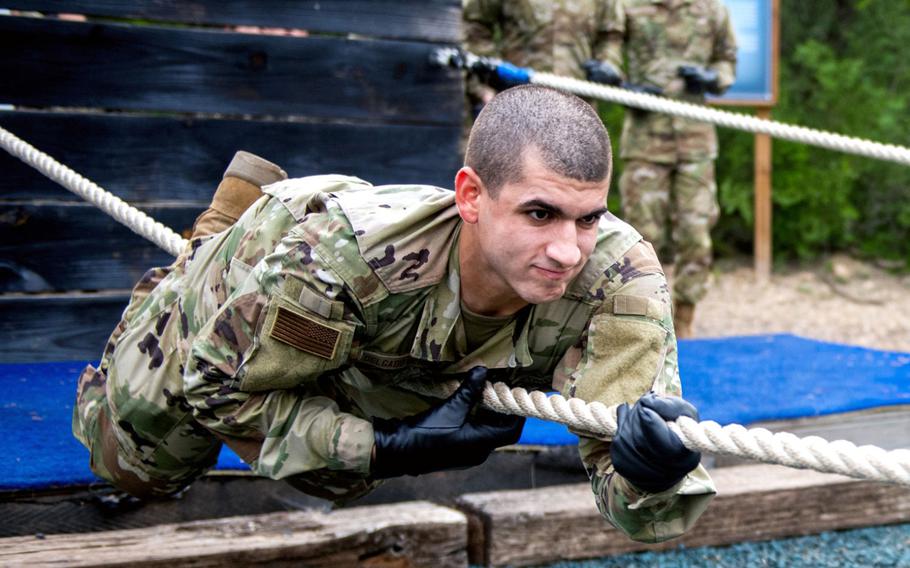 Alexie Delgado Berrios goes through the Leadership Reaction Course June 9, 2020, at Joint Base San Antonio-Chapman Annex, Texas. Delgado Berrios was taking part in the Air Force's Echo Flight program, which provides English language and cultural immersion before basic training.