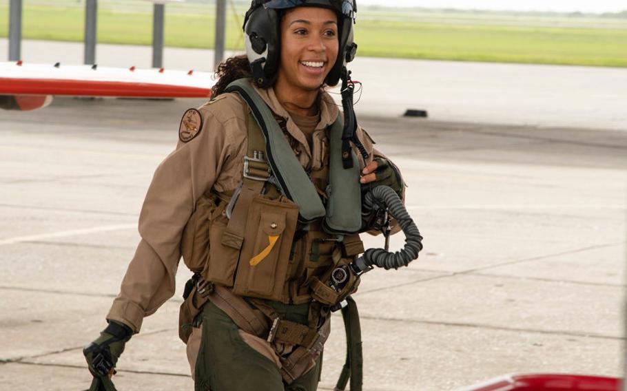 Student naval aviator Lt. j.g. Madeline Swegle, assigned to the Redhawks of Training Squadron (VT) 21 at Naval Air Station Kingsville, Texas, exits a T-45C Goshawk training aircraft following her final flight to complete the undergraduate Tactical Air (Strike) pilot training syllabus, July 7, 2020. 