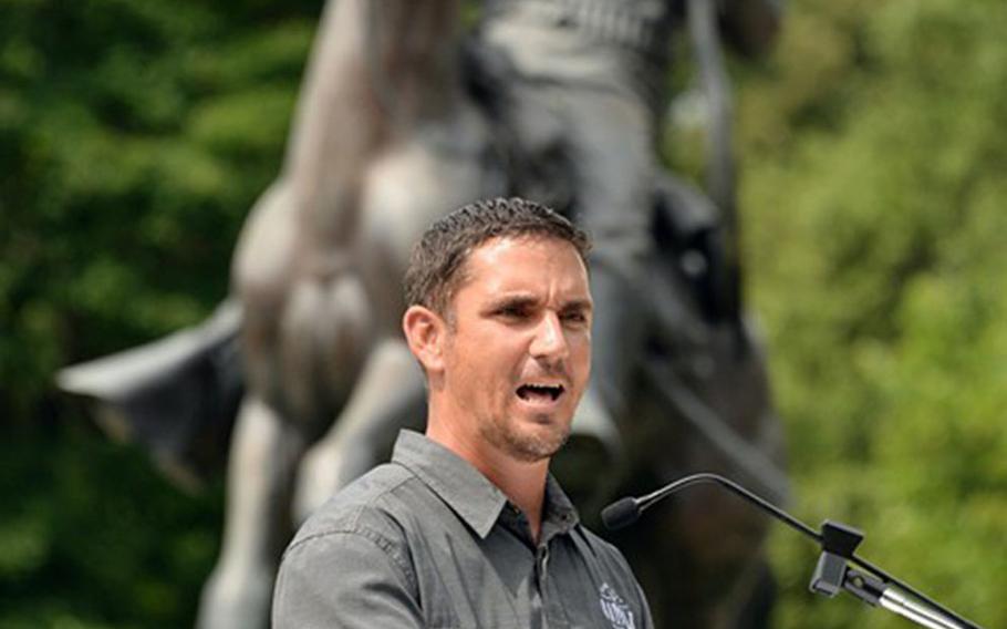 Retired Master Sgt. David Royer speaks at a ceremony at the Buffalo Soldier Monument, in Leavenworth, Kan., on July 16, 2020, where he was awarded the Soldier's Medal for heroism. Royer was awarded the Army's highest peacetime honor for stopping an active shooter on the bridge that links Kansas to Missouri in late May.