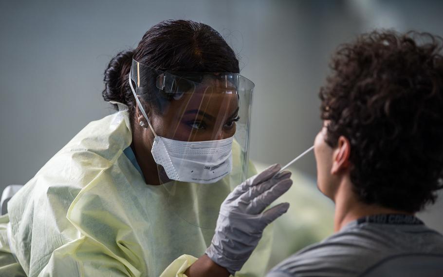 A basic cadet is tested for the coronavirus after arriving at the U.S. Air Force Academy in Colorado Springs, Colo., on June 25, 2020. Despite the academy taking numerous precautions to stem the spread of the virus, an unspecified number of cadets tested positive for it, officials said a week after classes began on Aug. 12.