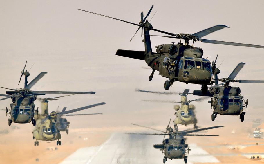 Six UH-60L Black Hawks and two CH-47F Chinooks launch a mission from Multinational Base Tarin Kowt, Afghanistan, in Jan. 2013. Beginning in October, soldiers selecting a career in aviation will be required to serve at least 10 years after graduating from flight training.