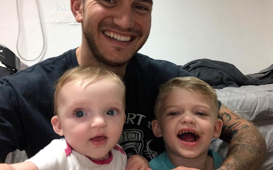 James Lobisch poses with daughter Abigail and son Zachariah.