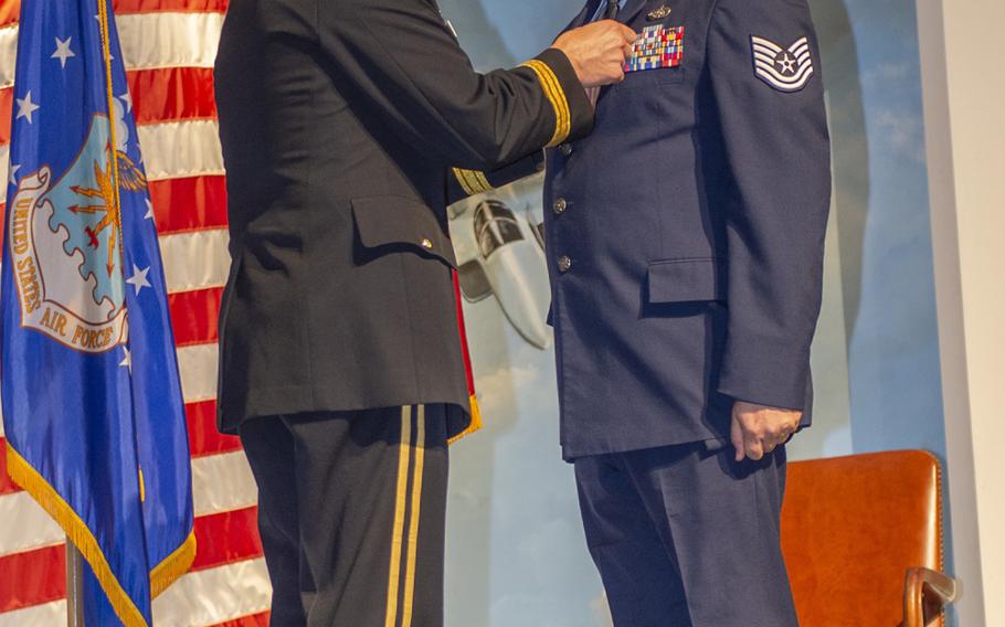 Air Force Tech. Sgt. Franklin Wetmore, of the 202nd Engineering Installation Squadron, 116th Air Control Wing, Georgia Air National Guard, was awarded the Purple Heart by Maj. Gen. Thomas Carden, Adjutant General of the Georgia Department of Defense, during a ceremony at the Museum of Aviation, Warner Robins, Ga., on Sept. 13, 2020. Wetmore earned the medal for service and wounds received during a Taliban attack on Bagram Airfield in December.