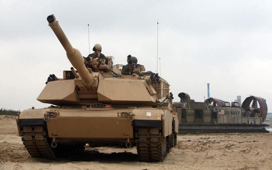 An M1A1 Abrams tank of Company C, 4th Tank Battalion, 4th Marine Division, leaves a Navy Landing Craft Air Cushion ship during an exercise in South Korea in 2014. The unit was deactivated in August and more than three dozen former unit members enlisted in the Idaho Army National Guard on Sept. 13, 2020.