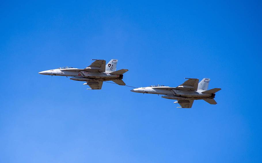 Two F/A-18 Super Hornet refuel during an air show at Naval Air Station Oceana, Va., Sept. 21, 2019.