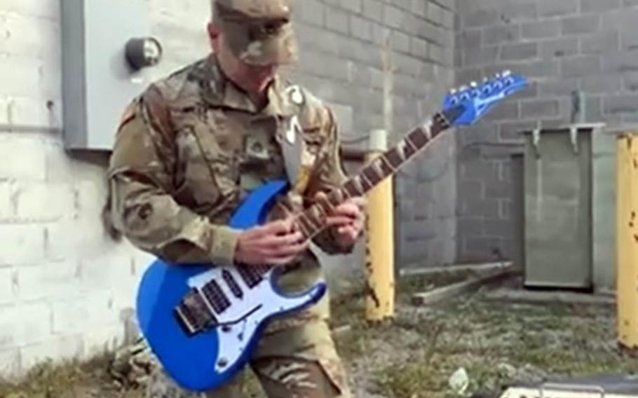 Staff Sgt. Austin West, an Army musician and recruiter in Watertown, N.Y., honors Eddie Van Halen by performing a medley of his group's hits in this screenshot from a Facebook Live broadcast, Wednesday, Oct. 7, 2020.