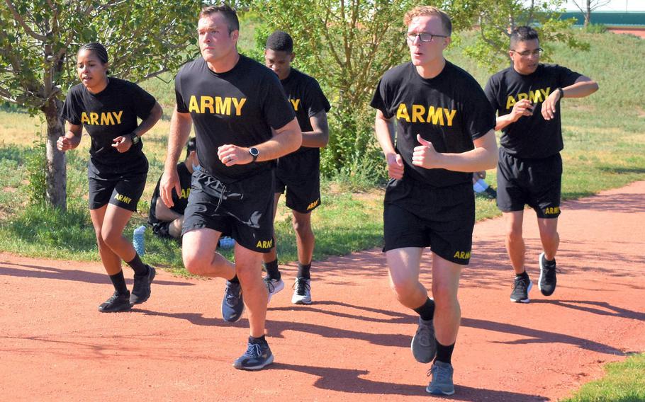 Soldiers with the 4th Infantry Division begin a two-mile run at Fort Carson, Colo., in June 2020. Service members and other patrons may now wear fitness gear to commissaries and military exchanges on Defense Department installations, Defense Secretary Mark Esper said in a memo dated Nov. 2, 2020.