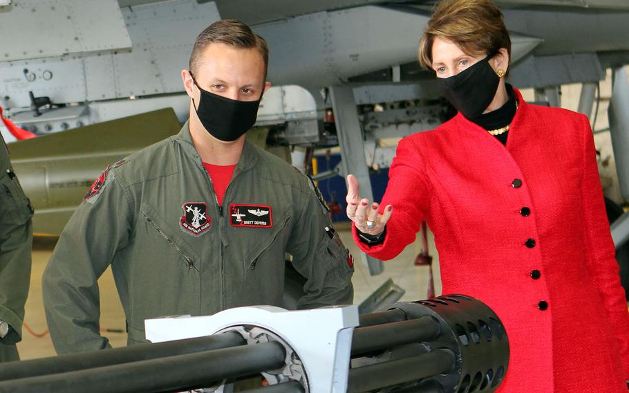 Maj. Brett DeVries briefs Air Force Secretary Barbara Barrett on the main weapon system used on an A-10 Thunderbolt II aircraft. The secretary visited Selfridge to award DeVries the Distinguished Flying Cross for superior aerial achievement, after he landed an A-10 with damaged landing gear and a missing canopy during a 2017 training flight over northern Michigan.