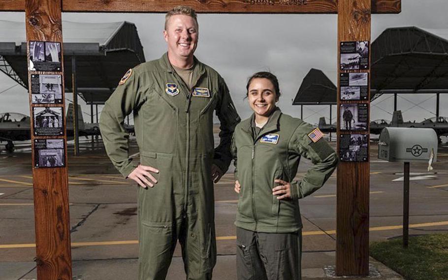 U.S. Air Force Maj. Nick Harris, left, and Capt. Jessica Wallander, instructor pilots with the 71st Flying Training Wing at Vance Air Force Base, Okla., stand side-by-side to illustrate the varying standing heights of Air Force pilots.