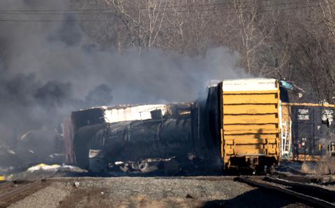 Smoke rises from a derailed cargo train in East Palestine, Ohio, on Feb. 4, 2023. 