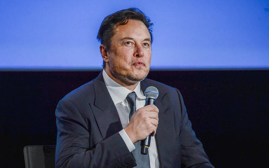 Tesla CEO Elon Musk looks up as he addresses guests at the Offshore Northern Seas 2022 meeting in Stavanger, Norway, on Aug. 29, 2022.  