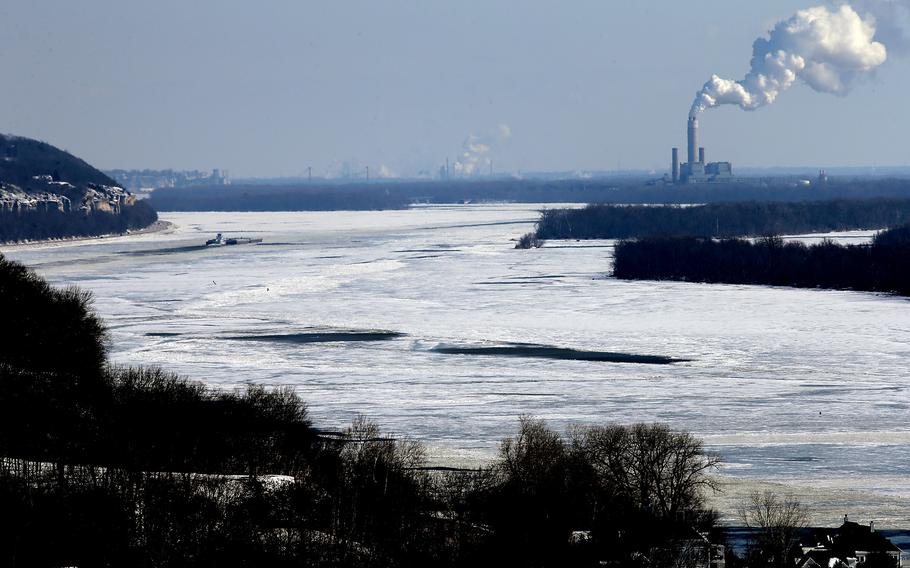 A tow barge enters the icy Mississippi River from the confluence with the Illinois River east of Grafton, Illinois on Friday, Feb. 12, 2021. “Serious concerns” over critically low water levels in the Mississippi River system led port authorities to limit vessel drafts near a key export hub on Friday, Oct. 21, 2022. 
