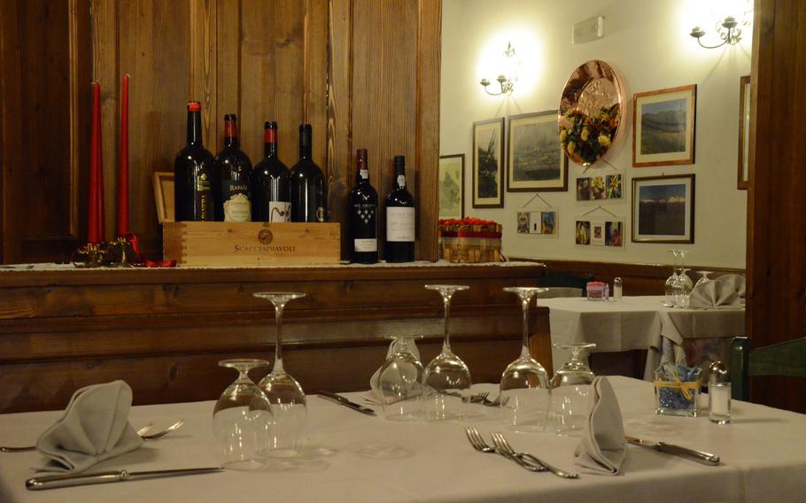 Enjoy a peaceful meal in the dining area of Il Rifugio, a restaurant situated in the foothills below Piancavallo, Italy.