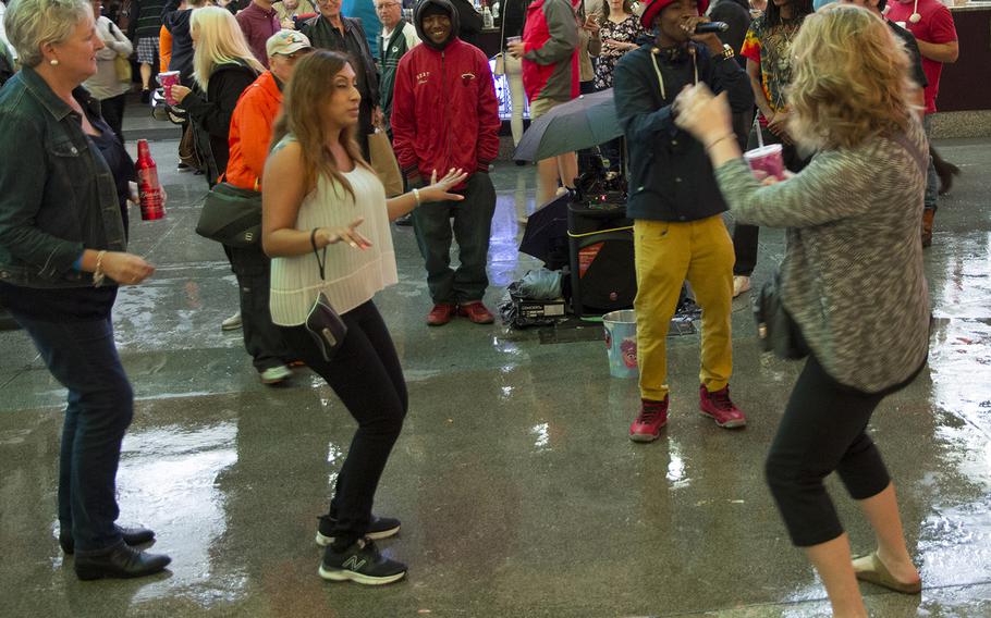 Tourists dance to the music at the Fremont Street Experience in downtown Las Vegas.