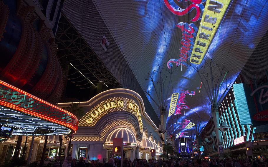 The Fremont Street Experience in downtown Las Vegas (a few miles north of the Strip) offers video and sound shows on a 1500-foot roof over the pedestrian walkway.