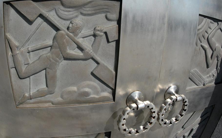 Flight-themed scenes on a door at the Wright Brothers National Memorial in Kitty Hawk, N.C.