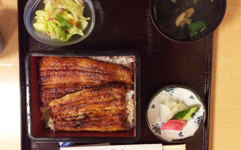 Time and effort goes into the unaju, which is charcoal-grilled eel dipped in a sweetened soy-based sauce over white rice, served at Kubota in western Tokyo.